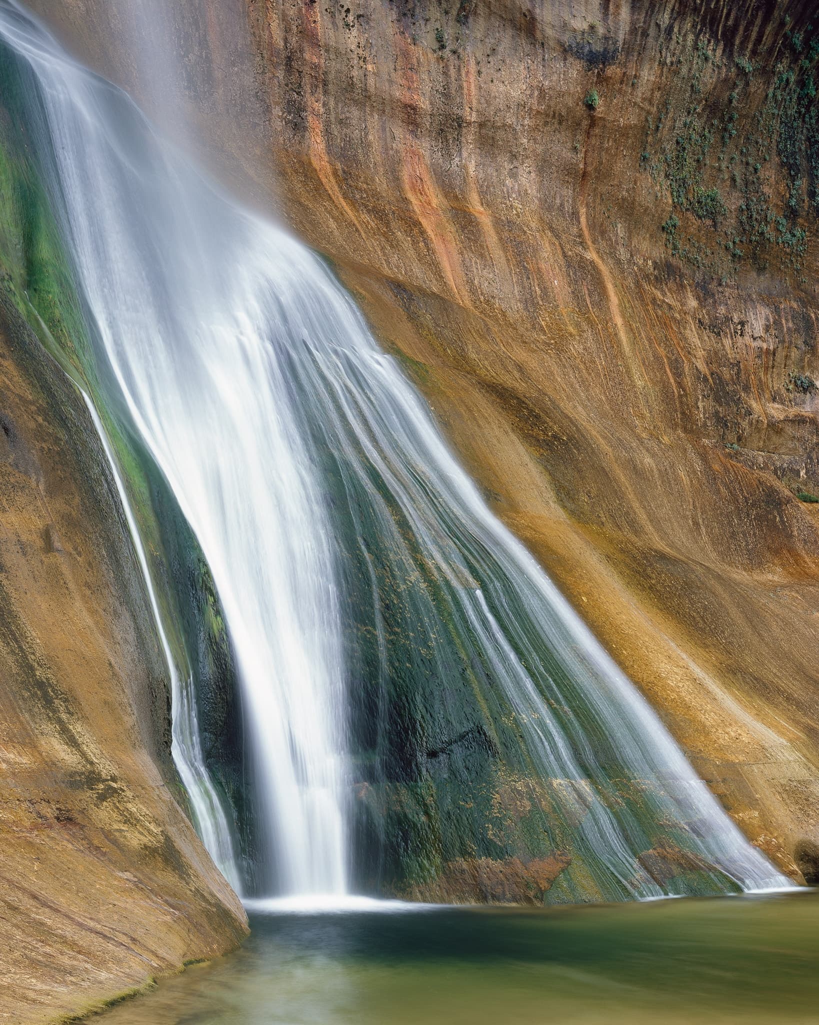 Lower Calf Creek Falls drops 126 feet into a pool of turquoise water in Grand Staircase-Escalante, Utah. Photograph by Marty Quinn